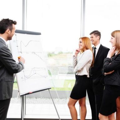 business concept - business people working with flipchart in office